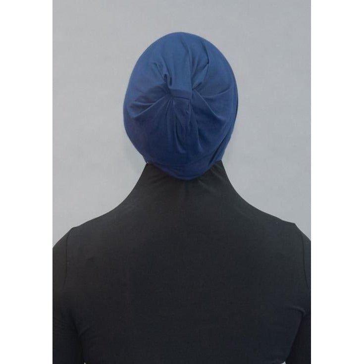 Criss Cross Tie-back Cap- Deep Sea Navy - Modestia Collection is a Detroit scarf based brand with a curated for Detroiter's and to the eclectic style of scarf lovers around the globe.