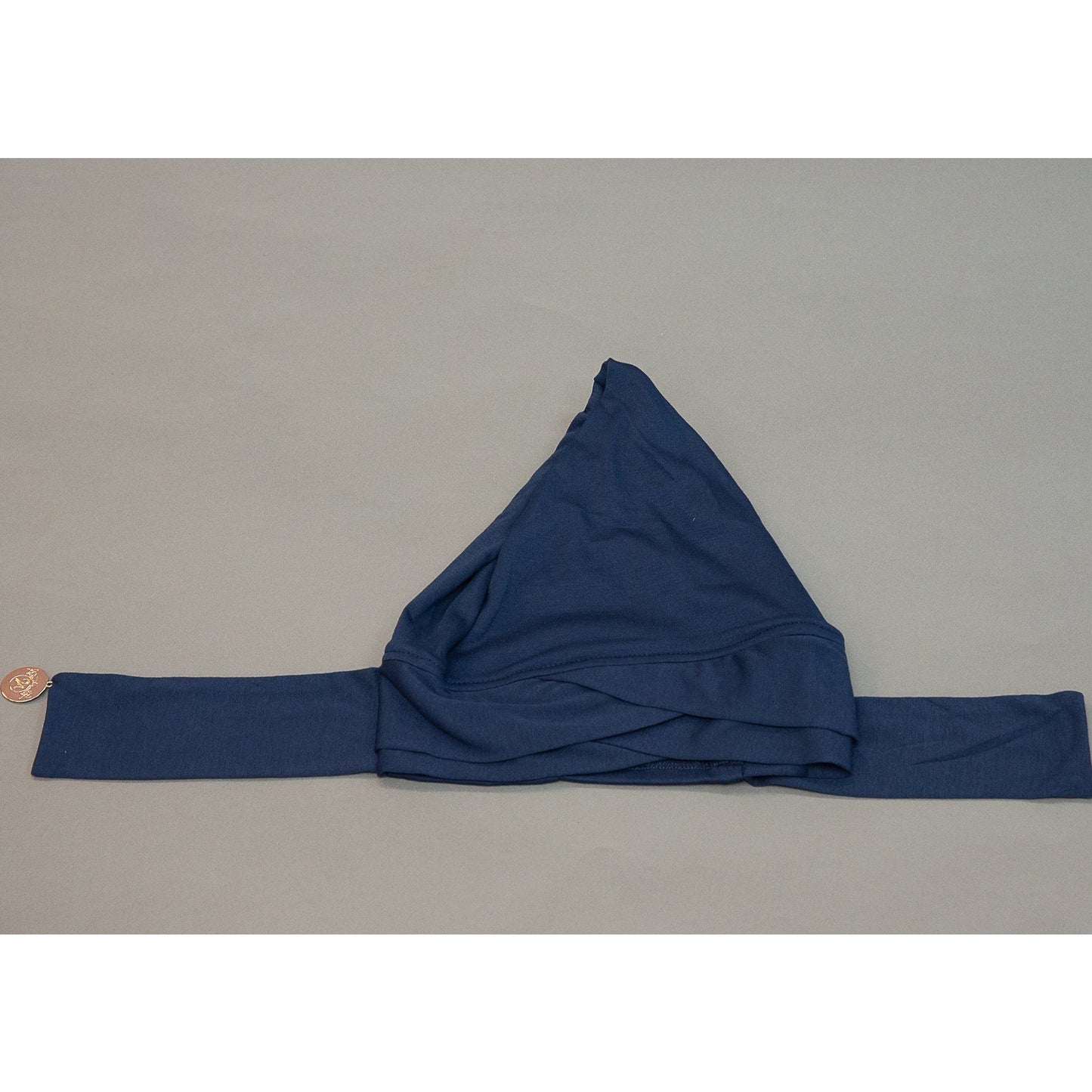 Criss Cross Tie-back Cap- Deep Sea Navy - Modestia Collection is a Detroit scarf based brand with a curated for Detroiter's and to the eclectic style of scarf lovers around the globe.
