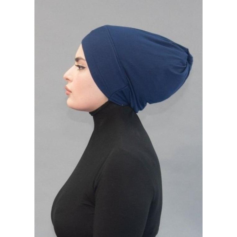 Criss Cross Tie-back Cap- Deep Sea Navy - Modestia Collection is a Detroit scarf based brand with a curated for Detroiter's and to the eclectic style of scarf lovers around the globe.
